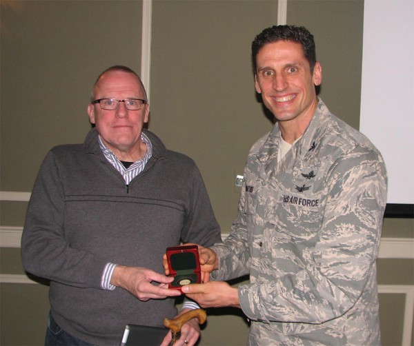 Dr. Kenneth L. Dick, Ph.D., telecommunications chair and senior research fellow, College of Information Science and Technology, University of Nebraska at Omaha, receives a token of appreciation from Col. Donovan L. Routsis, USAF, chapter president, following Dick’s speech on wireless security at the February luncheon.